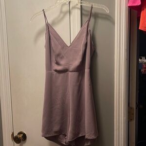 Boutique size Medium NWOT short jumper ties in the back has a cut out back ties